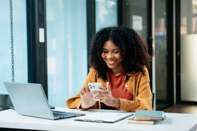 young woman reading about how to prioritize and make progress with her projects